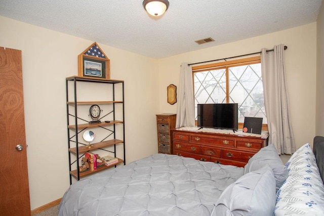 bedroom with a textured ceiling