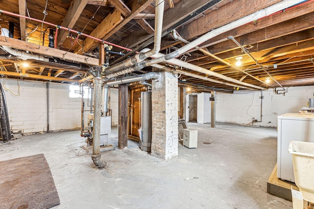 basement with washer / clothes dryer and gas water heater