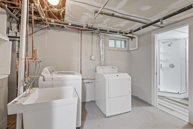 laundry room featuring sink and washer and clothes dryer