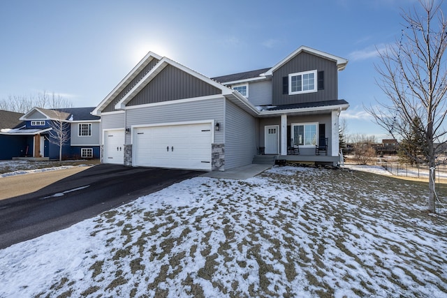 view of front of house with a garage and covered porch