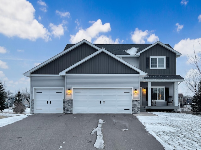 craftsman-style home with a garage and a porch