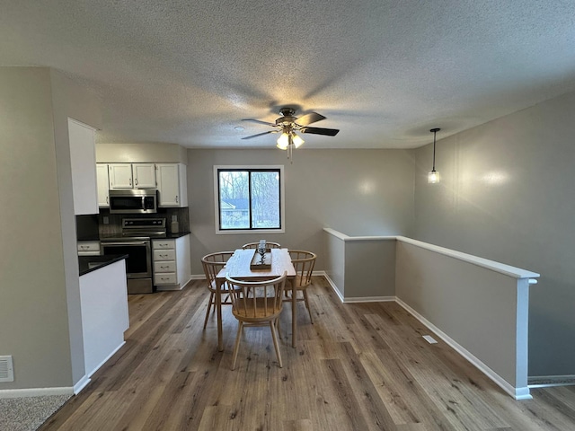 dining space featuring hardwood / wood-style floors