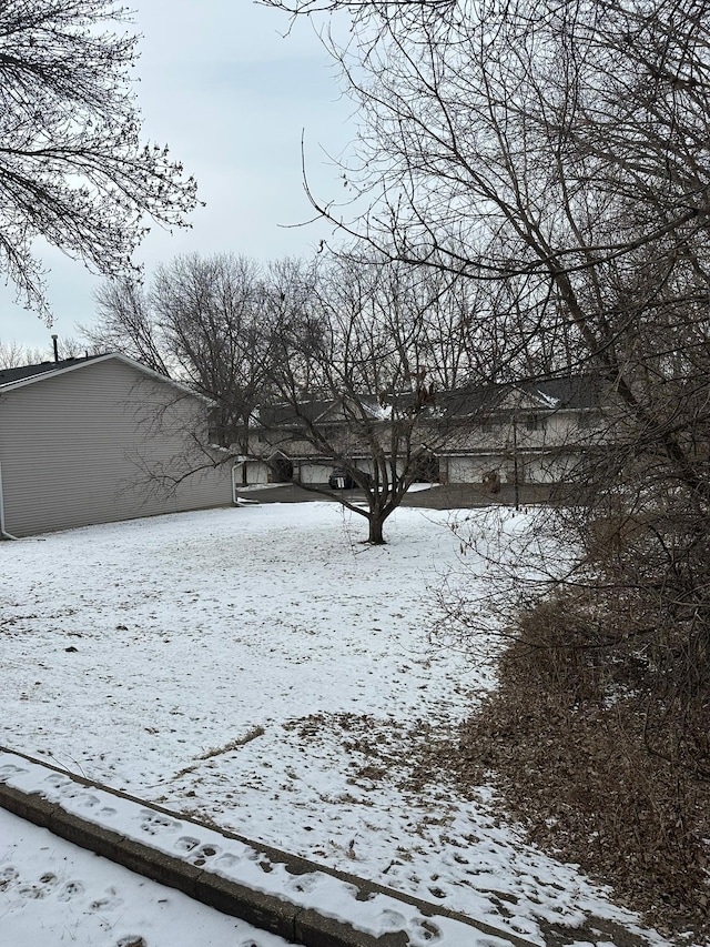 view of yard covered in snow