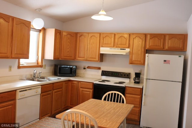 kitchen featuring white appliances, decorative light fixtures, and sink