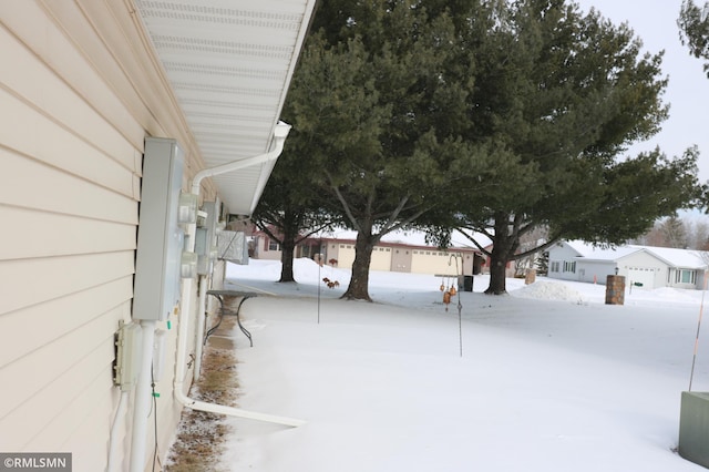 view of yard covered in snow