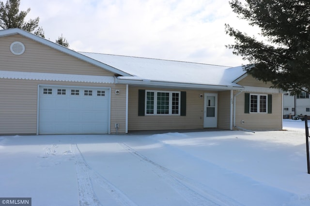 single story home featuring a garage