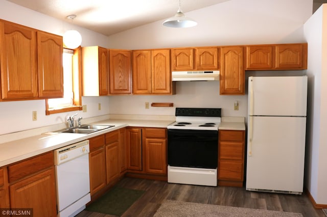 kitchen with sink, white appliances, dark hardwood / wood-style floors, and pendant lighting