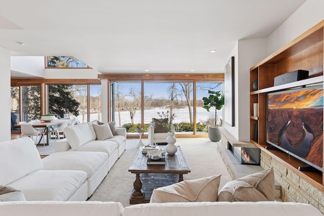 carpeted living area with recessed lighting