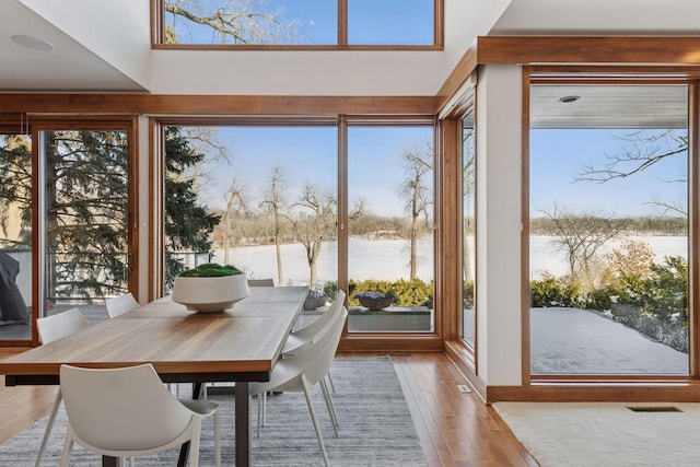 sunroom / solarium featuring visible vents and a healthy amount of sunlight