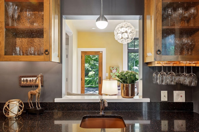 kitchen with decorative light fixtures and sink