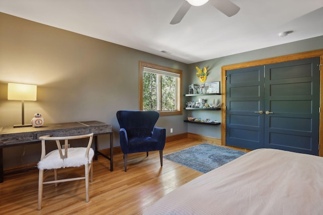 bedroom with ceiling fan and light hardwood / wood-style flooring