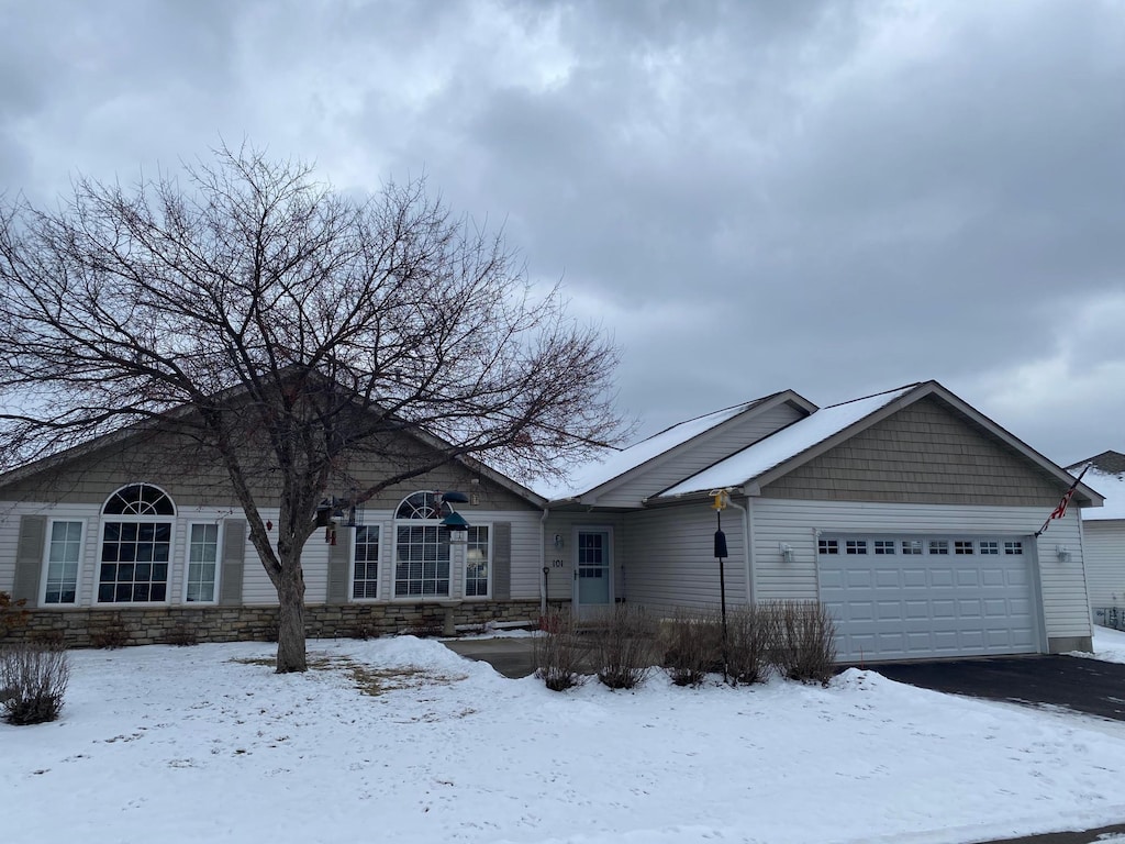 single story home featuring a garage