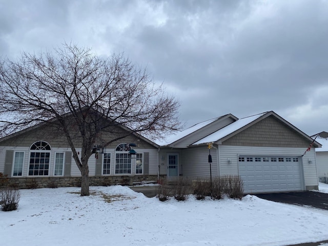 single story home featuring a garage