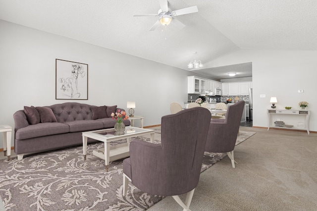 101 Bridgewater Trl, Hudson, WI 54016 - living room with ceiling fan, vaulted ceiling, light colored carpet, a textured ceiling, and baseboards
