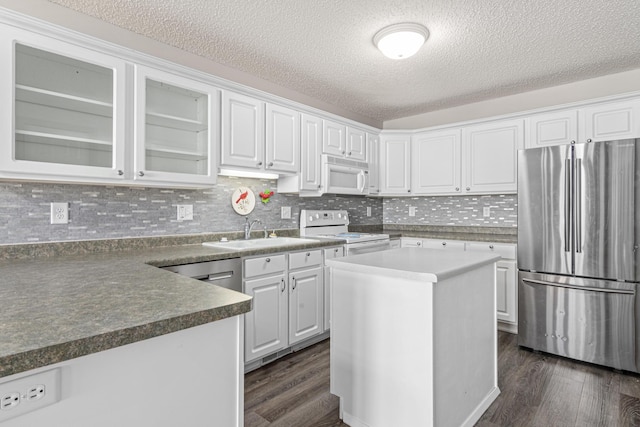 101 Bridgewater Trl, Hudson, WI 54016 - kitchen with white appliances, a sink, dark wood-style floors, white cabinets, and a textured ceiling