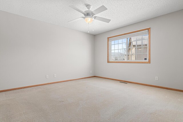 101 Bridgewater Trl, Hudson, WI 54016 - unfurnished room featuring carpet, a textured ceiling, baseboards, and ceiling fan