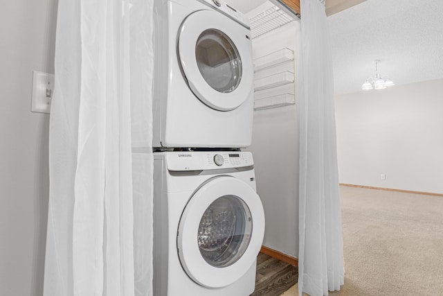 101 Bridgewater Trl, Hudson, WI 54016 - laundry room featuring estacked washer and dryer, baseboards, and carpet floors