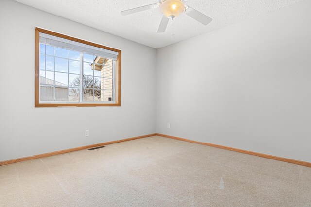 101 Bridgewater Trl, Hudson, WI 54016 - carpeted spare room featuring baseboards, a textured ceiling, and ceiling fan
