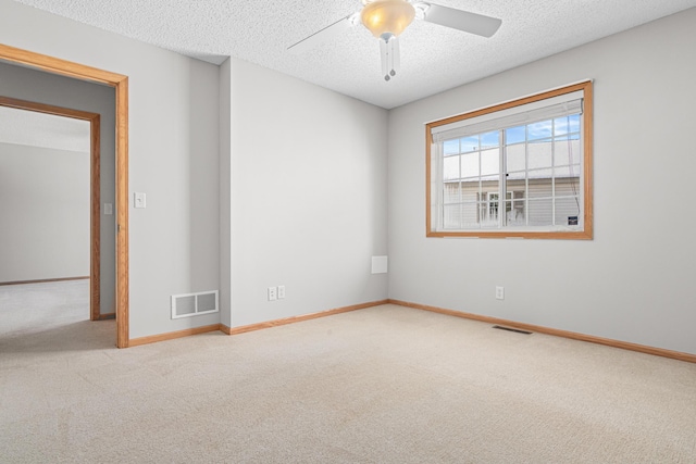 101 Bridgewater Trl, Hudson, WI 54016 - carpeted empty room with a ceiling fan, baseboards, and a textured ceiling