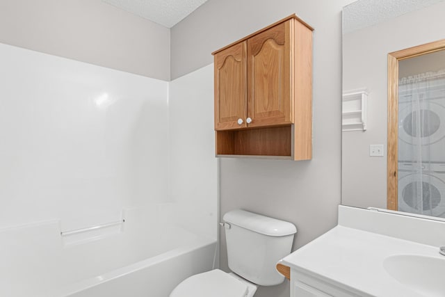 101 Bridgewater Trl, Hudson, WI 54016 - full bathroom with washer / dryer, a textured ceiling, vanity, and toilet