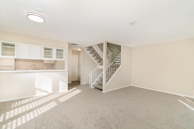 interior space featuring carpet floors and sink