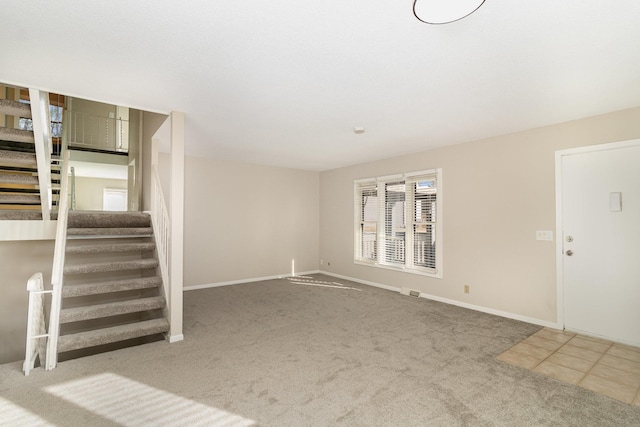 unfurnished living room with carpet flooring