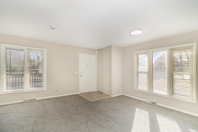 view of carpeted spare room