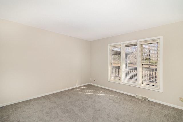 empty room featuring carpet flooring