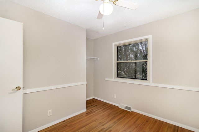 unfurnished room featuring wood-type flooring and ceiling fan