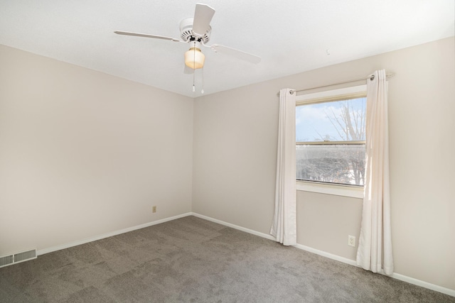 carpeted empty room featuring ceiling fan