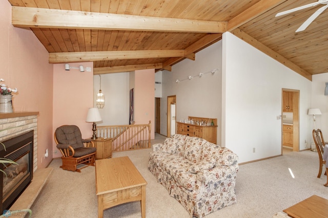 living room with lofted ceiling with beams and wooden ceiling