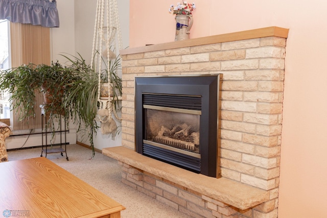 room details featuring a brick fireplace and carpet floors