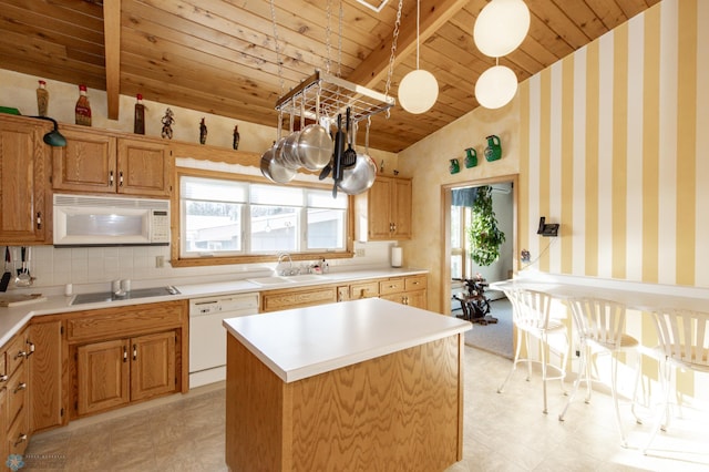 kitchen with sink, white appliances, a kitchen island, decorative light fixtures, and wooden ceiling