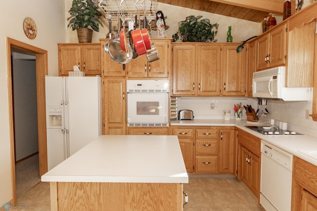 kitchen featuring white appliances, lofted ceiling with beams, decorative backsplash, and a center island