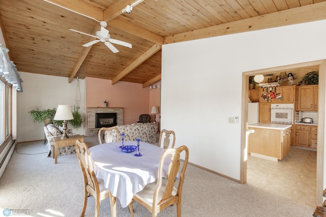 dining area with a fireplace, lofted ceiling with beams, light carpet, and wooden ceiling