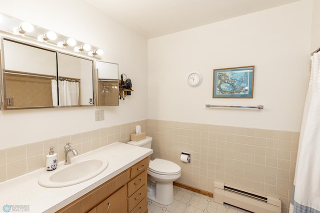 bathroom featuring tile walls, vanity, a baseboard radiator, toilet, and walk in shower