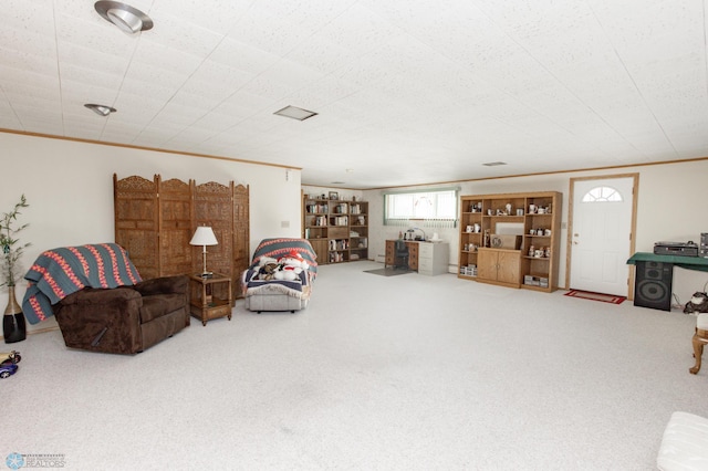 living room with crown molding and carpet