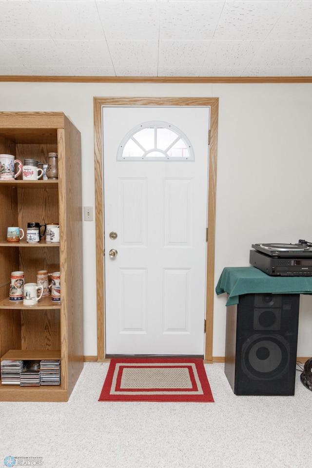 foyer entrance with carpet