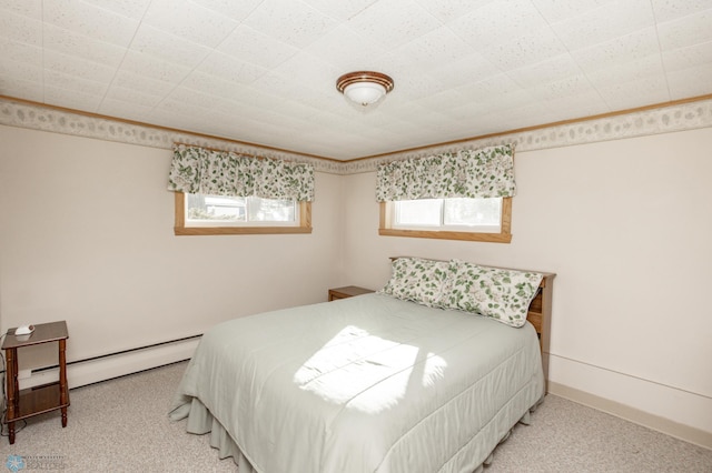 carpeted bedroom featuring a baseboard radiator