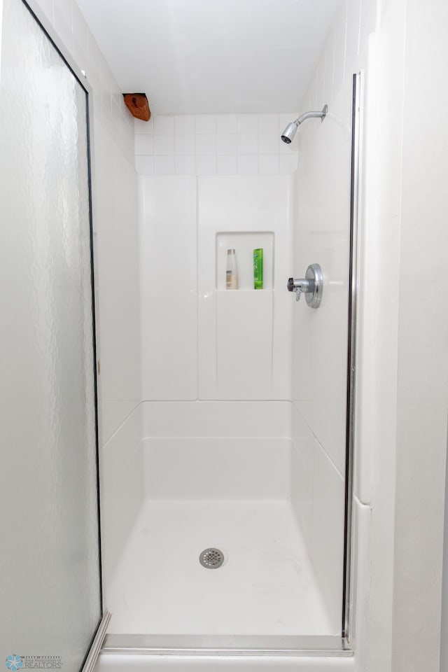 bathroom featuring an enclosed shower