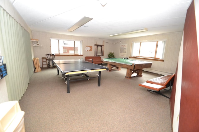 recreation room featuring carpet floors and baseboard heating