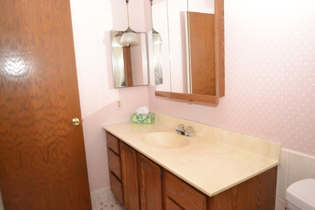 bathroom featuring vanity and toilet