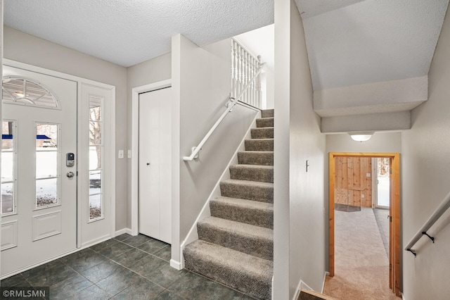 entrance foyer with a textured ceiling