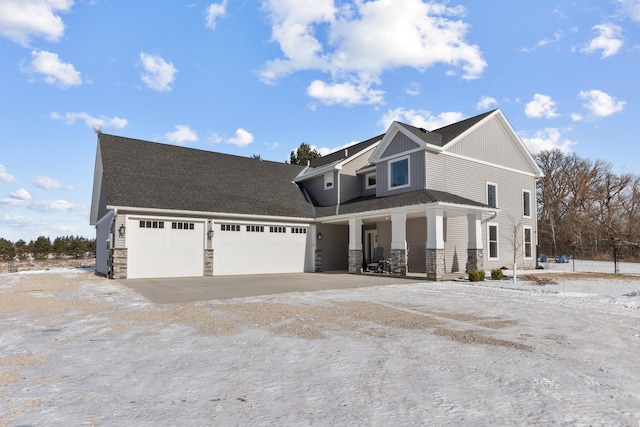 view of front of house with a garage and a porch