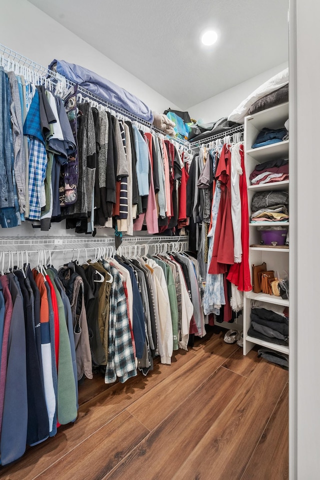 spacious closet featuring hardwood / wood-style flooring