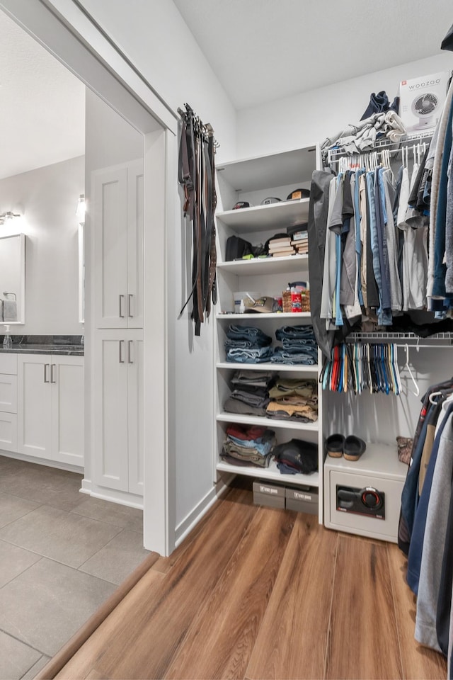 spacious closet featuring light wood-type flooring