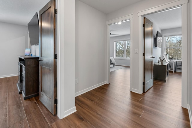 corridor with dark wood-type flooring