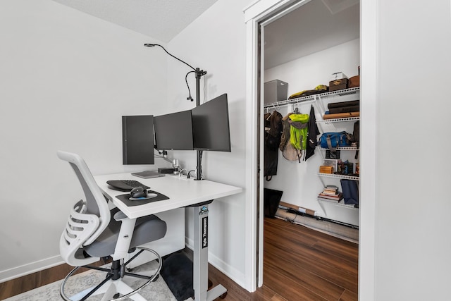 home office featuring dark hardwood / wood-style flooring