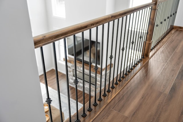 staircase featuring wood-type flooring