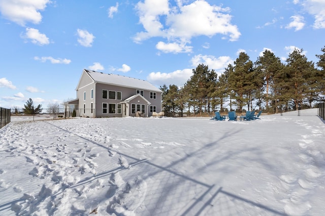 view of snow covered house